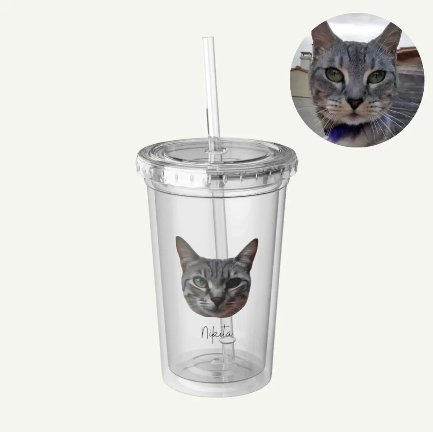 Personalized pet tumbler with a cat image named 'Nikita' and a secure lid with a straw.