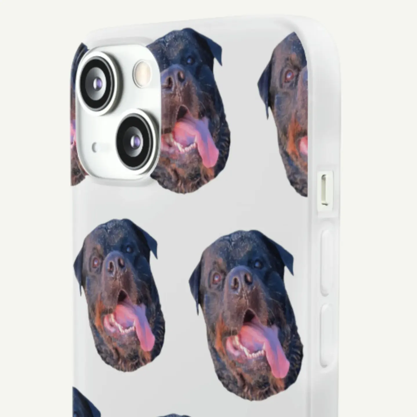 Close-up of a custom phone case decorated with multiple images of a Rottweiler's expressive face, emphasizing personal pet style